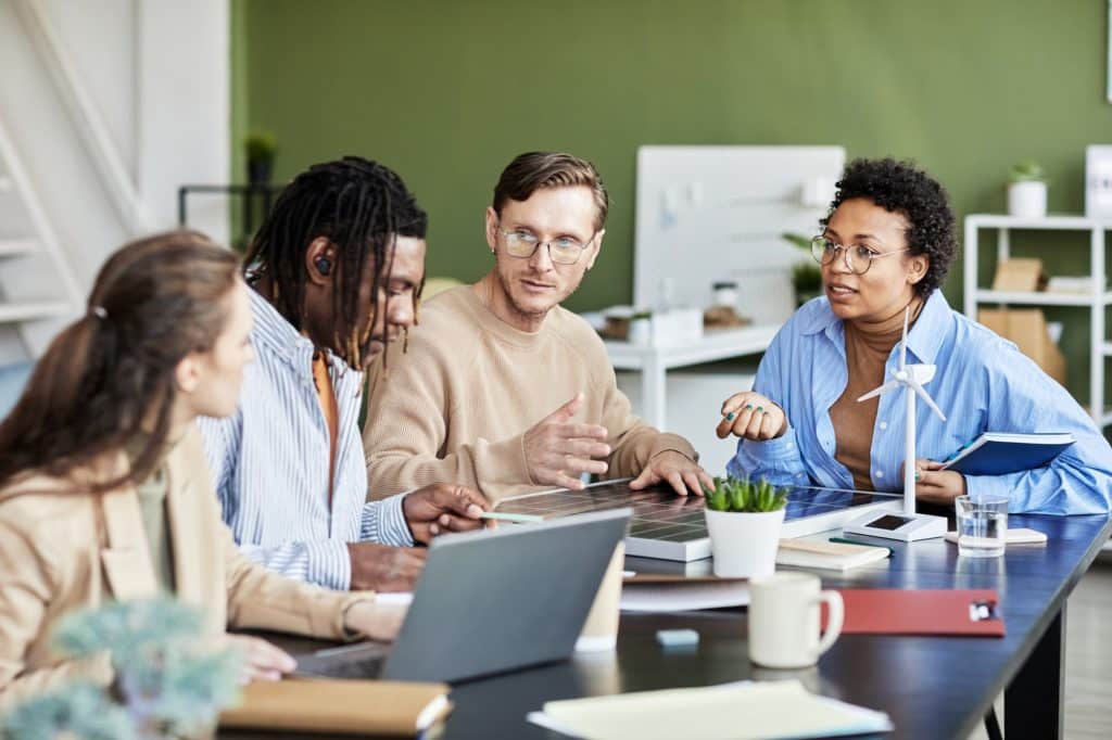 Colleagues working in team at office